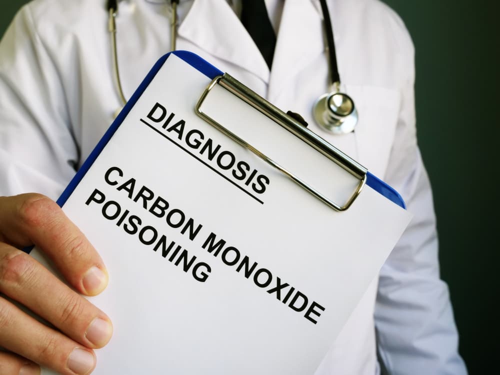 Doctor holds diagnosis Carbon monoxide poisoning.
